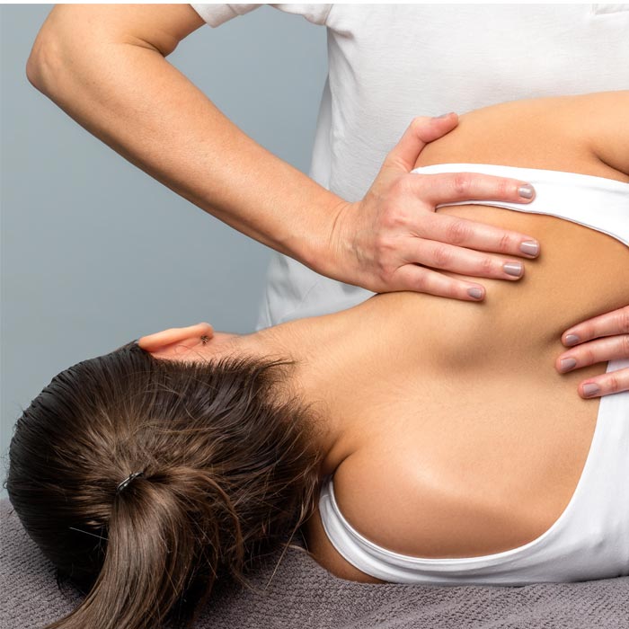 Chiropractor working on patients back