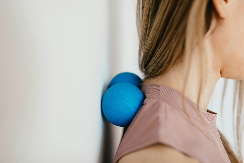 Women using a roller for her back pain