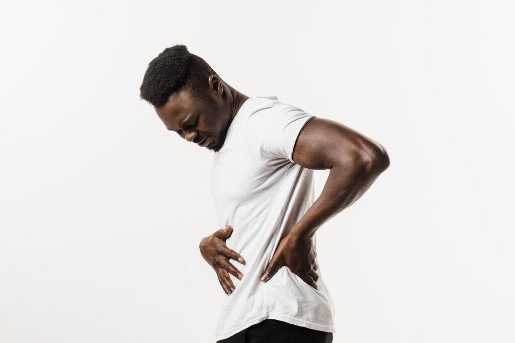 African american man with pelvic inflammatory disease on white background. PID infection of one or more of the upper reproductive organs, including the uterus, fallopian tubes and ovaries.