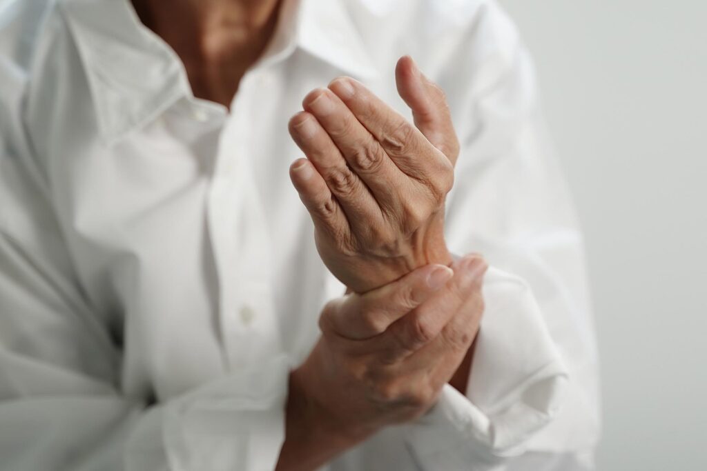 Man struggling with Arthritis in his hand